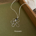 Silver Flower Pendant And Baroque Pearl Cord Necklaces view 4