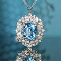 Silver Tone Ocean Blue Oval Halo Crystal Pendant Necklace view 1
