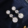 White Metal Triple Round Bezel Clear Drop Earrings Pair view 3