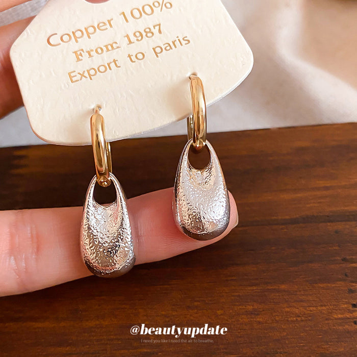 Gold Tone Hoop Earrings With Textured Silver Drop Charms