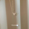Gold Tone Bow and Pearl Y Necklace with Fine Chain view 4