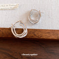 Silver Tone Polished Interlocking Double Hoop Earrings view 2