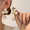 White Iridescent Flower and Pearl Look Dangle Earrings view 1