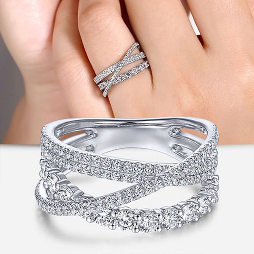 Product view showing silver-tone crisscross multi-rail round-stone wide ring
