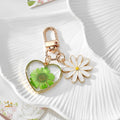 Gold Tone Daisy and Pressed Flower Heart Snap-Hook Keychains in Ten Options view 7