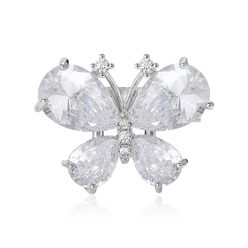 Front view of the clear crystal butterfly brooch in two metal tones with polished metal detail on a white background