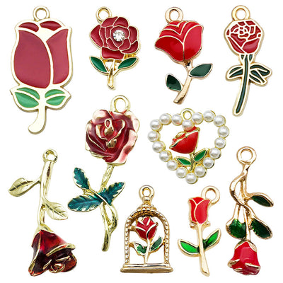 Gold-tone flower charms arranged on a light background