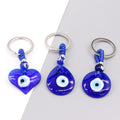 Silver Tone Blue Glass Evil Eye Clip Keychains in Five Shapes view 1