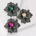 Black Filigree Flower Brooch with Colored Center Crystal view 1