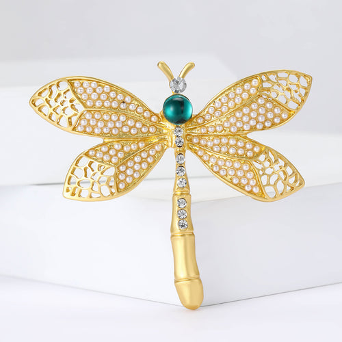 Gold pearl dragonfly brooch teal head front on white blocks