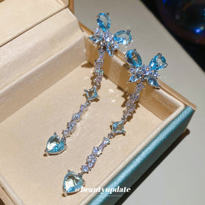 Silver-Tone Light Blue Bow Drop Earrings with Heart Ends