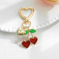 Gold Heart Clasp Charm Keychain With Bow Cherry Accent view 2