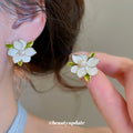 White Layered Flower Stud Earrings With Gold Tone Edges view 1