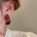 Dark Silver Tone Oval Stud Earrings With Faceted Red Centers view 3