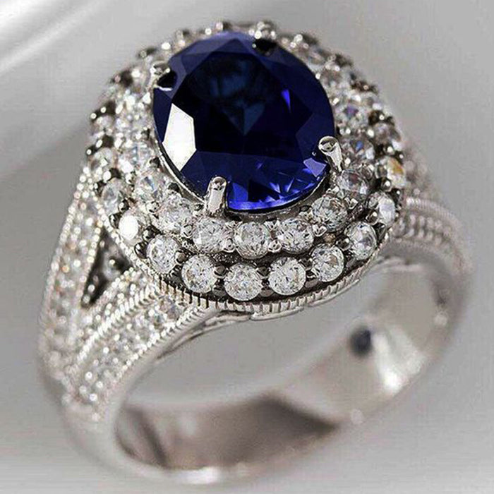 Deep Blue Oval Double-Halo Ring In Polished Silver Tone
