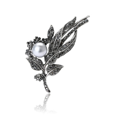 Gunmetal black rhinestone leaf spray brooch with gray pearl front view