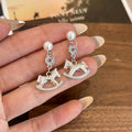 Gold and Silver Rocking Horse Pearl Look Dangle Earrings view 4