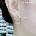 Gold Tone Crisscross Drop Earrings With Clear Round Stones view 5