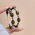 Dark Metal Hoop Earrings with Brown Oval Cabochons view 6