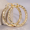 Gold Tone Large Faceted Hammered Texture Hoop Earrings view 2