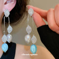 Blue Leaf and Pearl-Like Drop Earrings with Polished Metal Details view 1