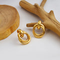 Twelve Gold Tone Sculptural Knot and Hoop Earring Collection view 9