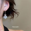 Silver Tone Crystal Heart Drop Huggie Earrings With Crown Detail view 3