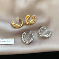 Interlocking Double Hoop Clip On Earrings in Gold and Silver view 1