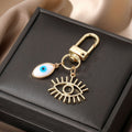 Gold Tone White Shell Evil Eye Charm Clip Keychains in Six Shapes view 4