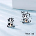 Black and White Cow Stud Earrings with Peach Accents view 4