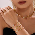 Round Halo Zircon Station Bracelet Gold and Steel Tones view 1