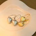 Gold and Silver Polished Heart Small Huggie Earrings view 1