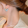 Polka Dot Heart Huggie Hoop Earrings in Brown and Blue view 3