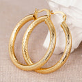 Gold Tone Cross Grid Textured Large Tube Hoop Earrings view 2