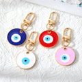 Gold Tone Oversized Round Evil Eye Clip Keychains in Two Colors view 1