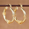Gold Tone Rope Wrap Accent Tube Hoop Latch Earrings view 1