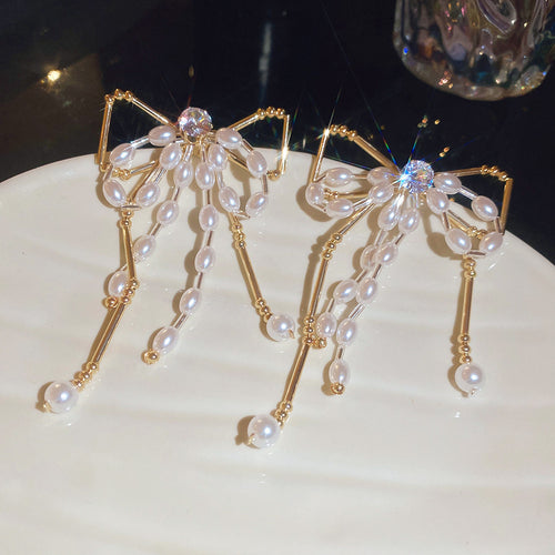 Gold-Tone Crystal Bow and Pearl Stud Earrings shown as the lead style image