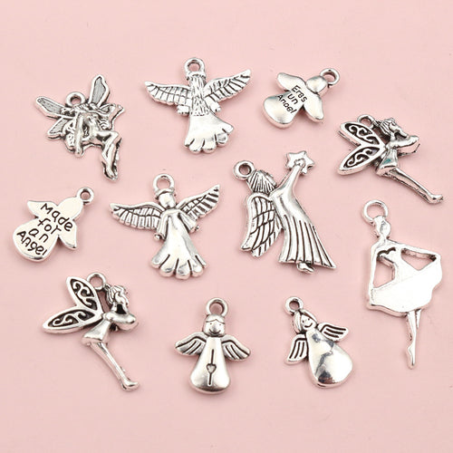 Finish comparison of angel and fairy metal charms in seven figure designs