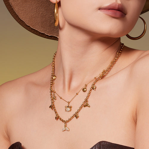 Neckline view of sea life multicharm necklaces in main image 2.