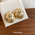 Gold Tone Oval Stud Earrings With Black Floral Cutouts view 4