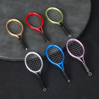 Six mini tennis racket charms in gold, red, green, silver, blue and purple metallic finishes