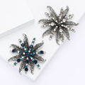 Spiky Leaf Crystal Flower Brooch in Blue or Black With Faceted Center view 1