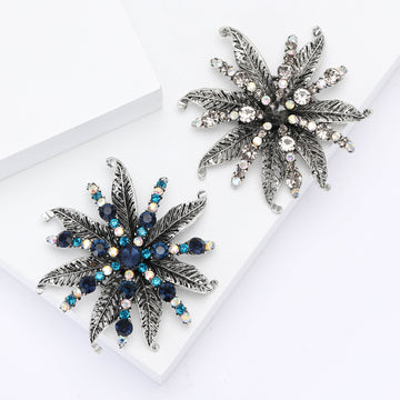 Spiky Leaf Crystal Flower Brooch in Blue or Black With Faceted Center