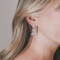 Silver Tone Graduated Leaf Drop Earrings with Clear Stones view 2