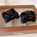 Black Satin Bow Hair Claw With Layered Loops And Knotted Center view 3