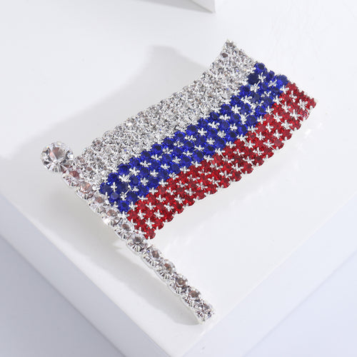 Angled view of the tricolor crystal flag brooch