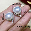 Silver Tone Pearl Stud Earrings with Curved Clear Stone Accents view 4