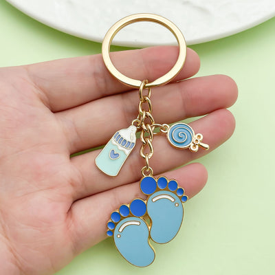 Image 1 showing a person holding up two key chains.