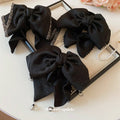 Black Glitter Crystal Edge Bow Hair Claw With Mismatched Gray Variant Image view 2