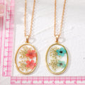 Gold Tone Oval Resin Pressed Flower Pendant Necklaces in Six Colors view 4